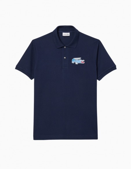 POLO LACOSTE L.12.12 CON INSIGNIA CLÁSICO AZUL...